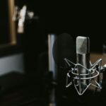 macro photography of silver and black studio microphone condenser